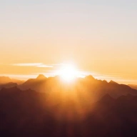 sun setting over the mountains